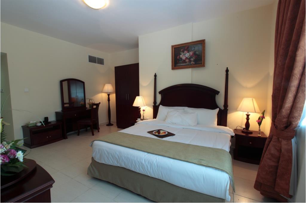 Tulip Inn Royal Suites Adschman Zimmer foto