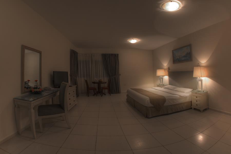 Tulip Inn Royal Suites Adschman Zimmer foto